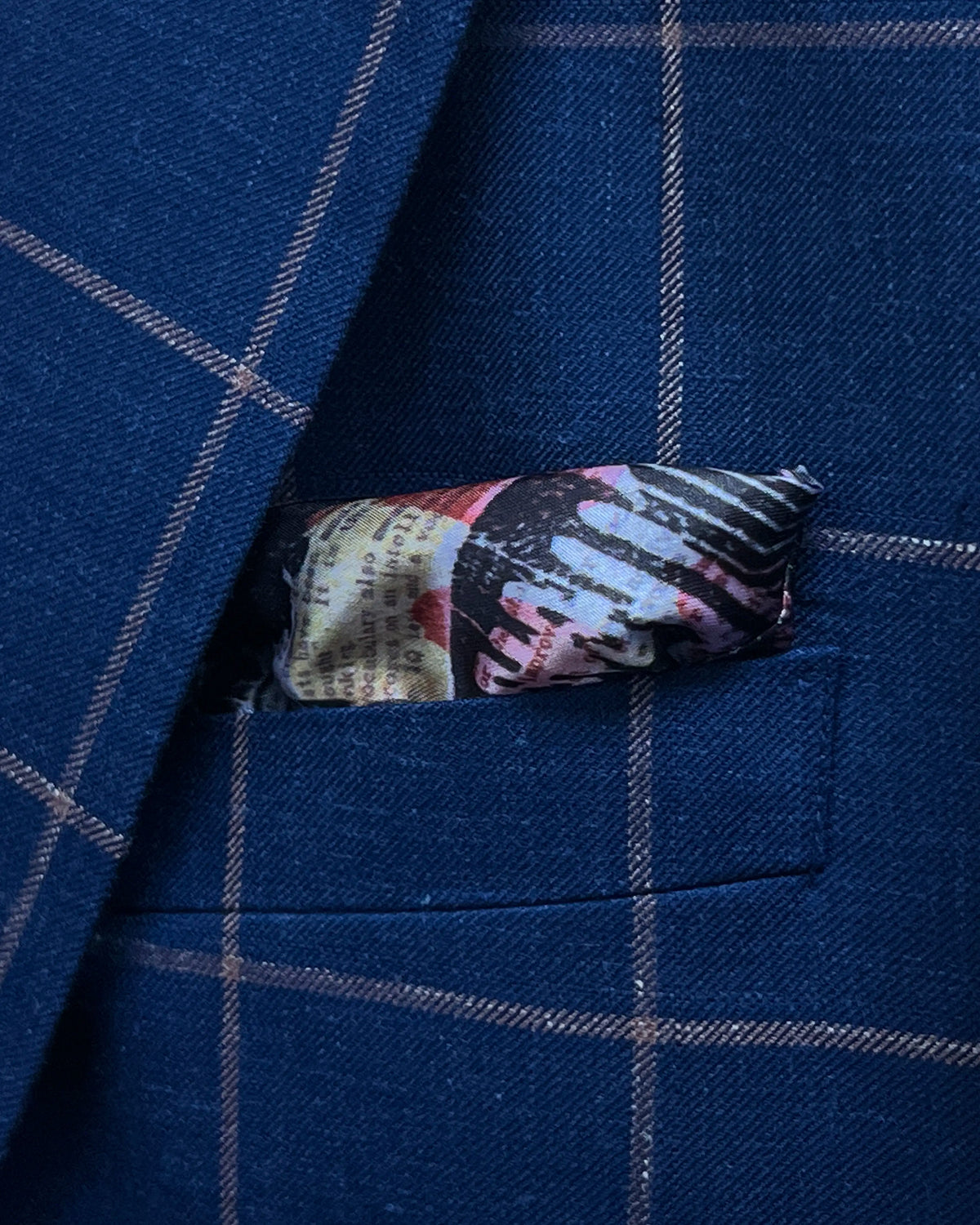 Breast pocket detail of Royal Blue Crimson Windowpane men's sport coat showing the built in lining pocket square