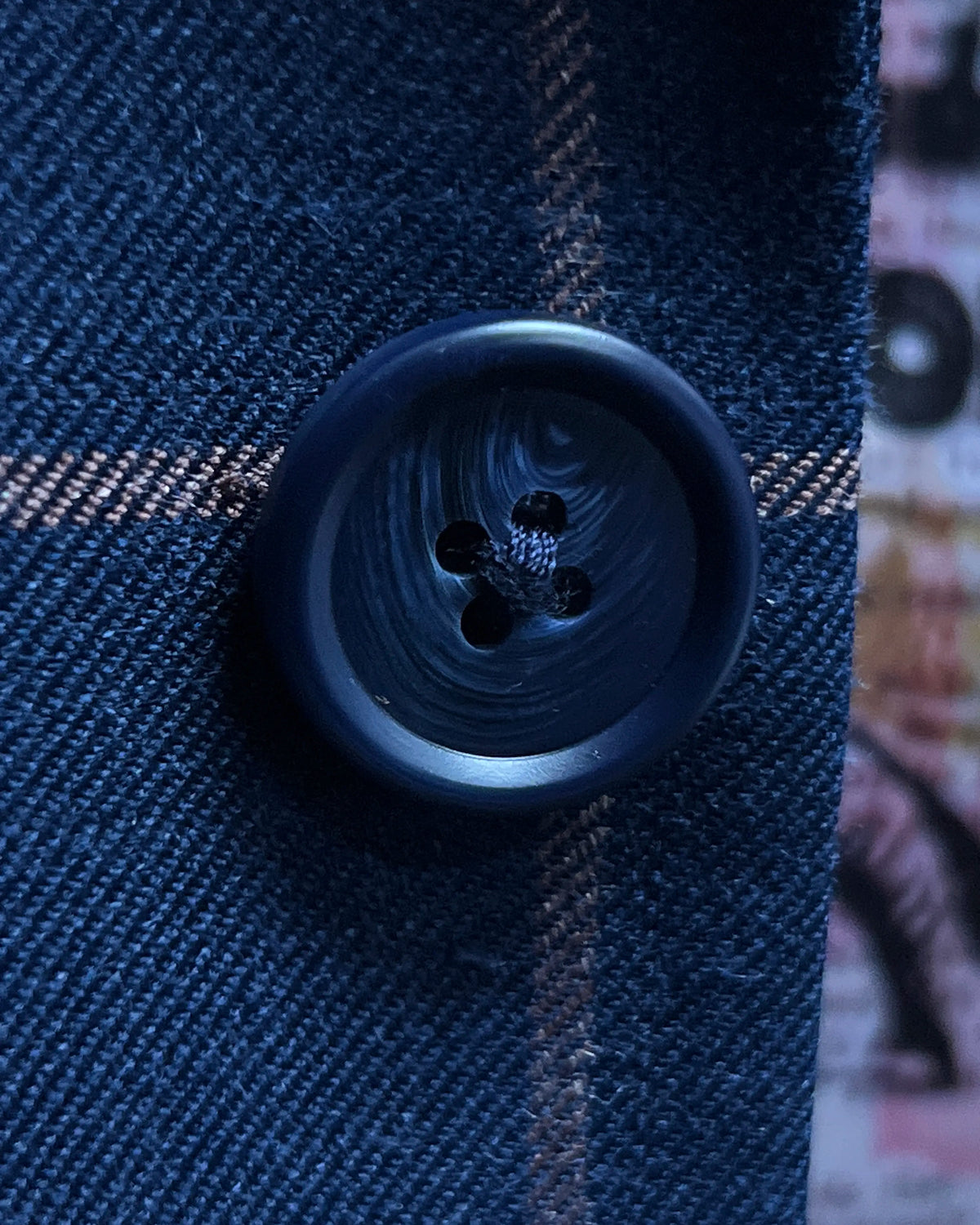 Button detail of Royal Blue Crimson Windowpane men's sport coat showing dark navy horn buttons
