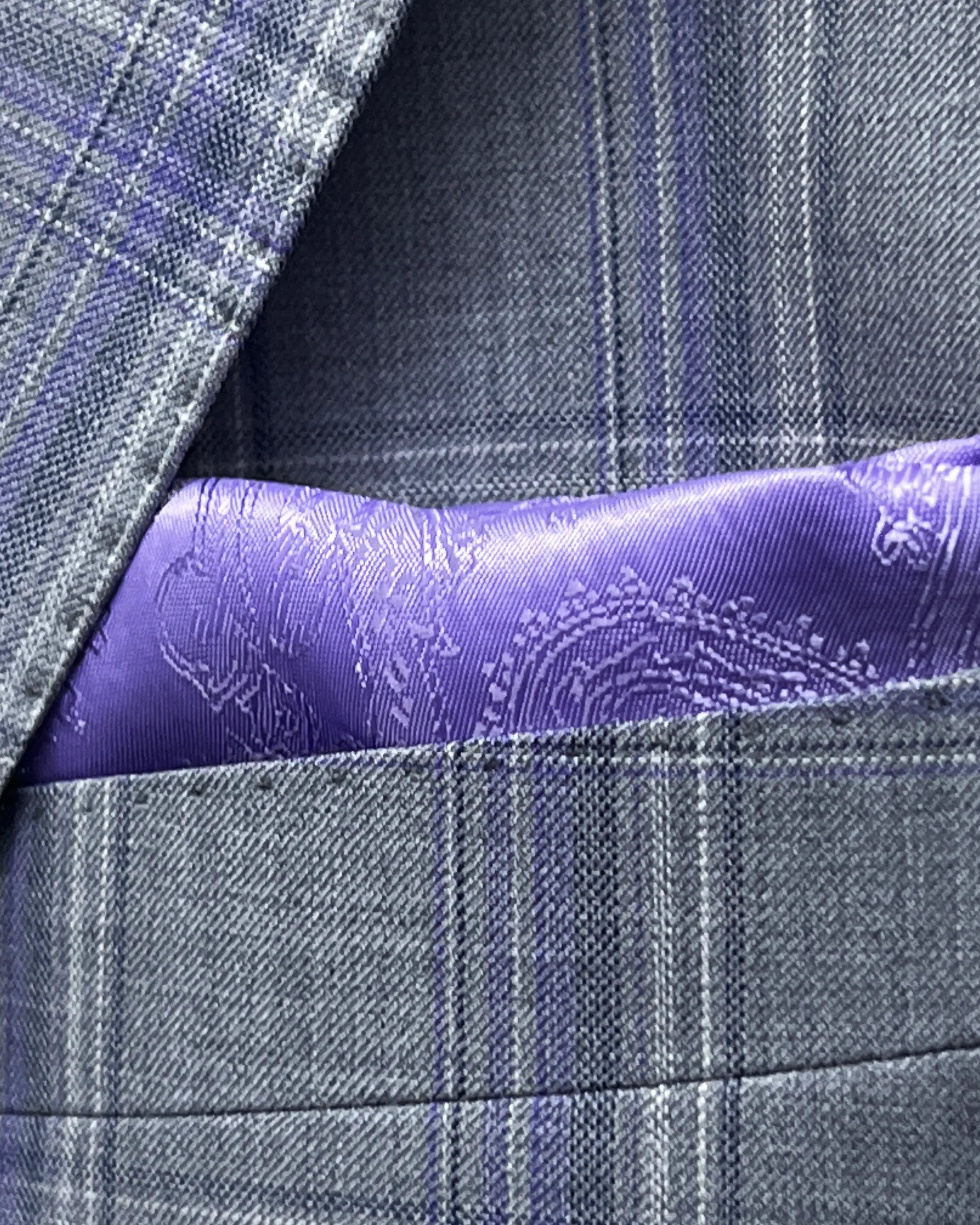 Breast pocket view of Steel Grey Windowpane men's sport coat showing the matching purple lining pocket square.