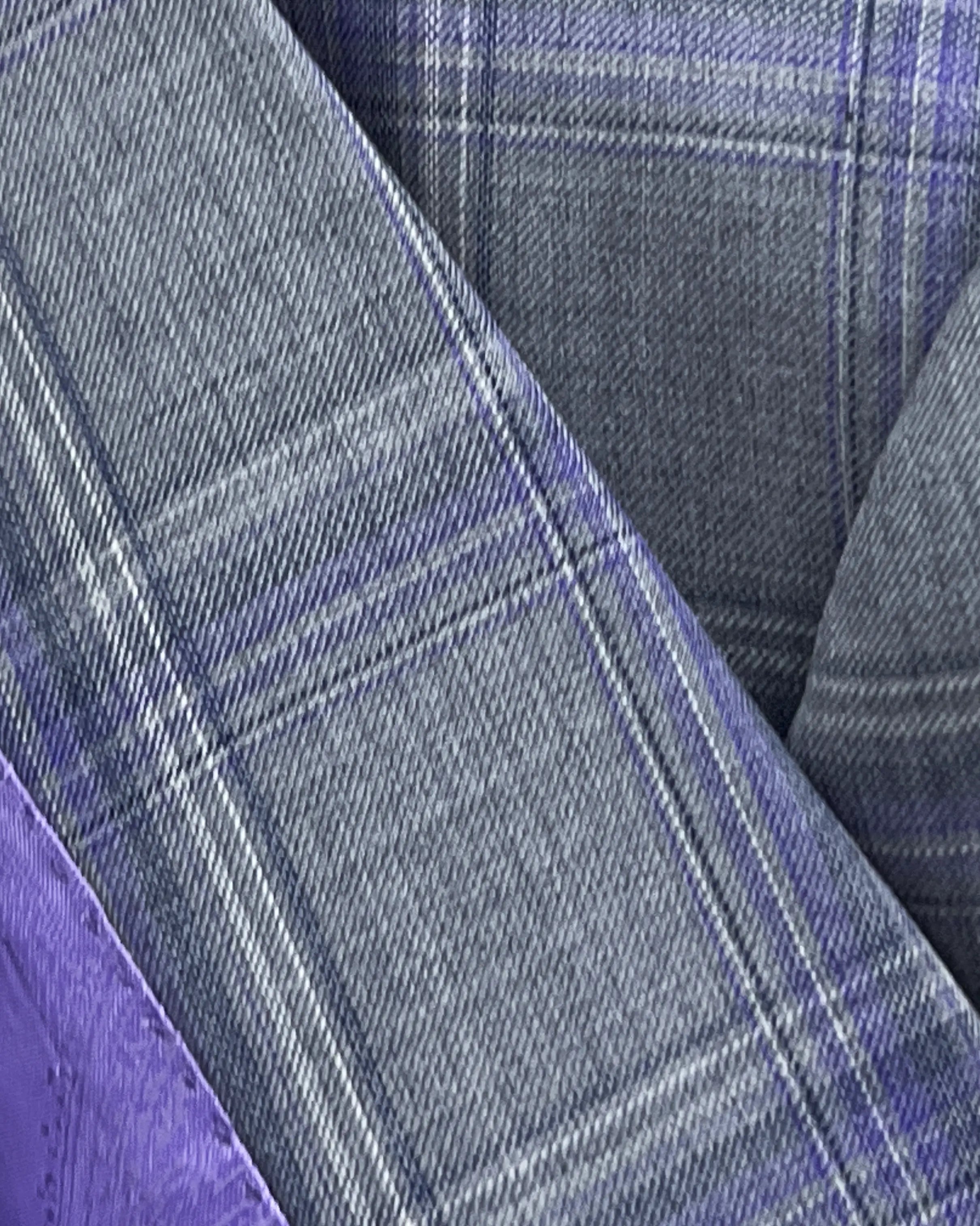 Fabric close up of Steel Grey Windowpane men's sport coat showing the woven windowpane cloth texture and fine yarn detail.