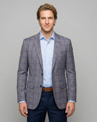 Front model view of Steel Grey Windowpane men's sport coat showing the full front silhouette, notch lapels, straight flap pockets, and matching pocket square.