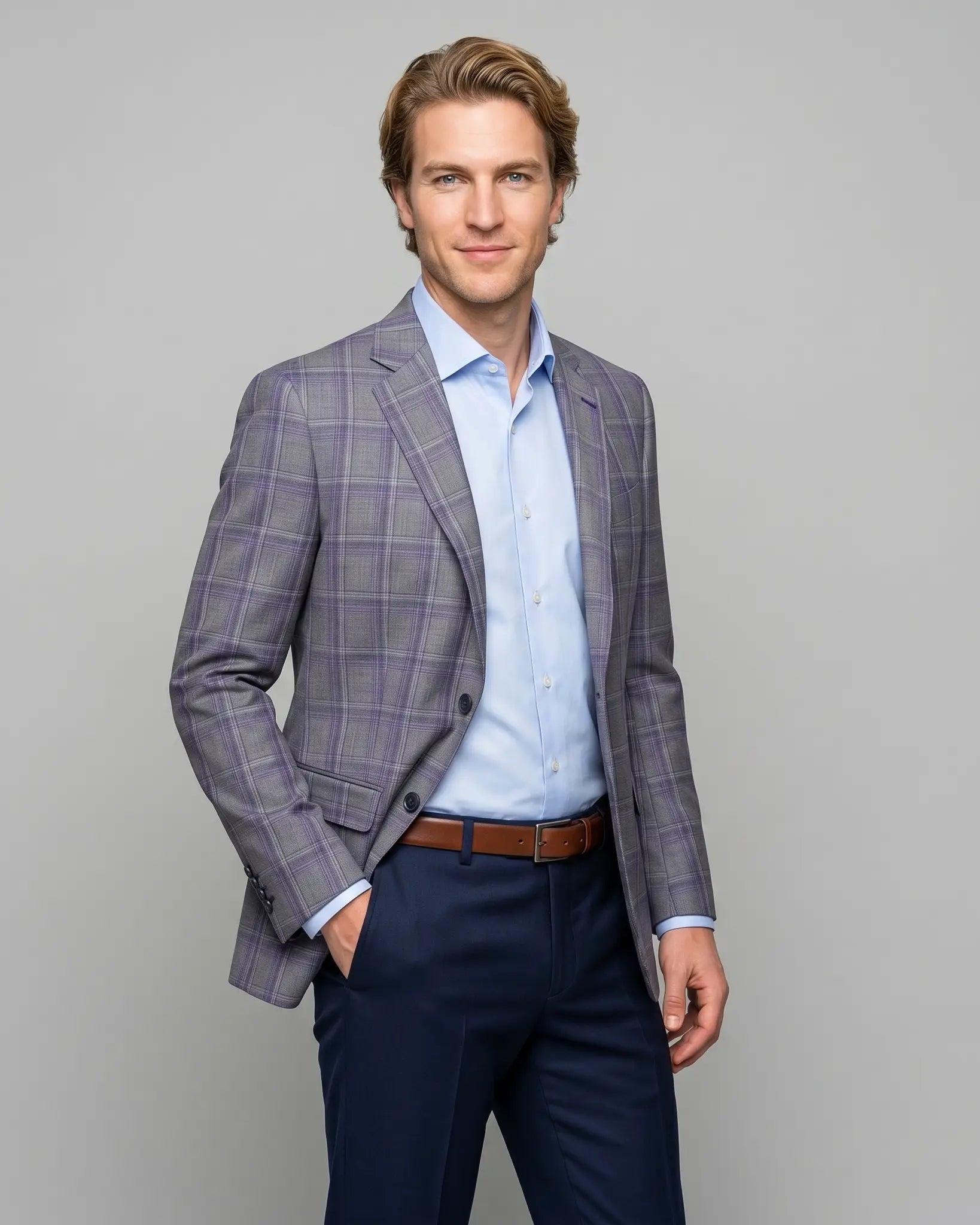 Side model view of Steel Grey Windowpane men's sport coat showing the tailored waist shape, open front, and sleeve button detailing.
