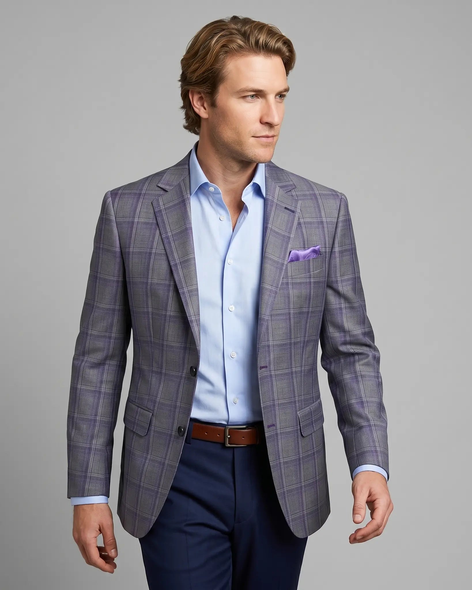 Angled model view of Steel Grey Windowpane men's sport coat showing the jacket drape, lapel roll, and natural lining glimpse.