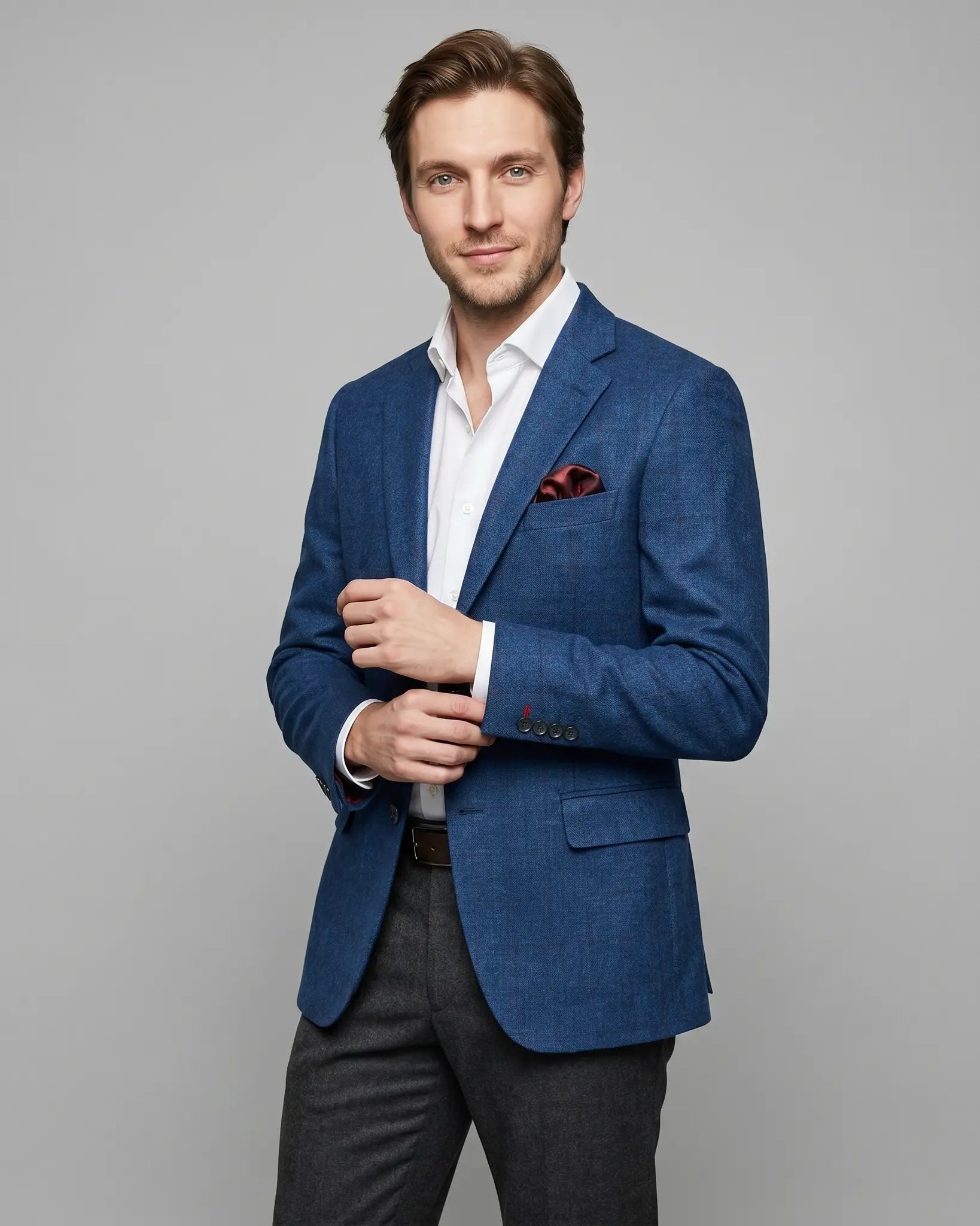 Side view of teal blue with red windowpane men's sport coat showing the angled editorial model pose
