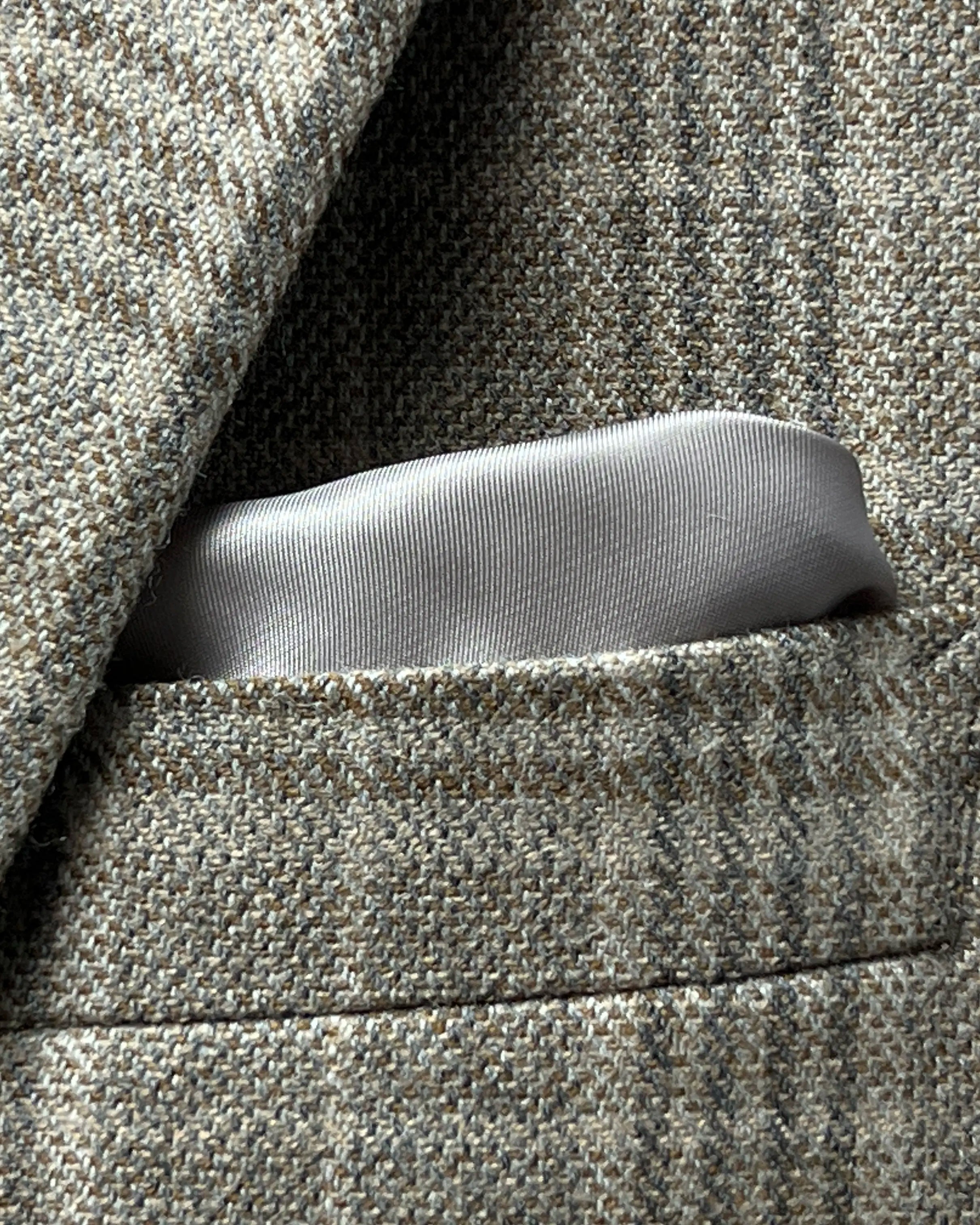 Breast pocket detail of Warm Taupe Textured Check men's sport coat showing the built in lining pocket square