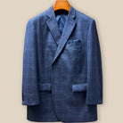 Close-up of steel grey Westwood Hart suit jacket showing detailed navy windowpane pattern and buttonhole craftsmanship