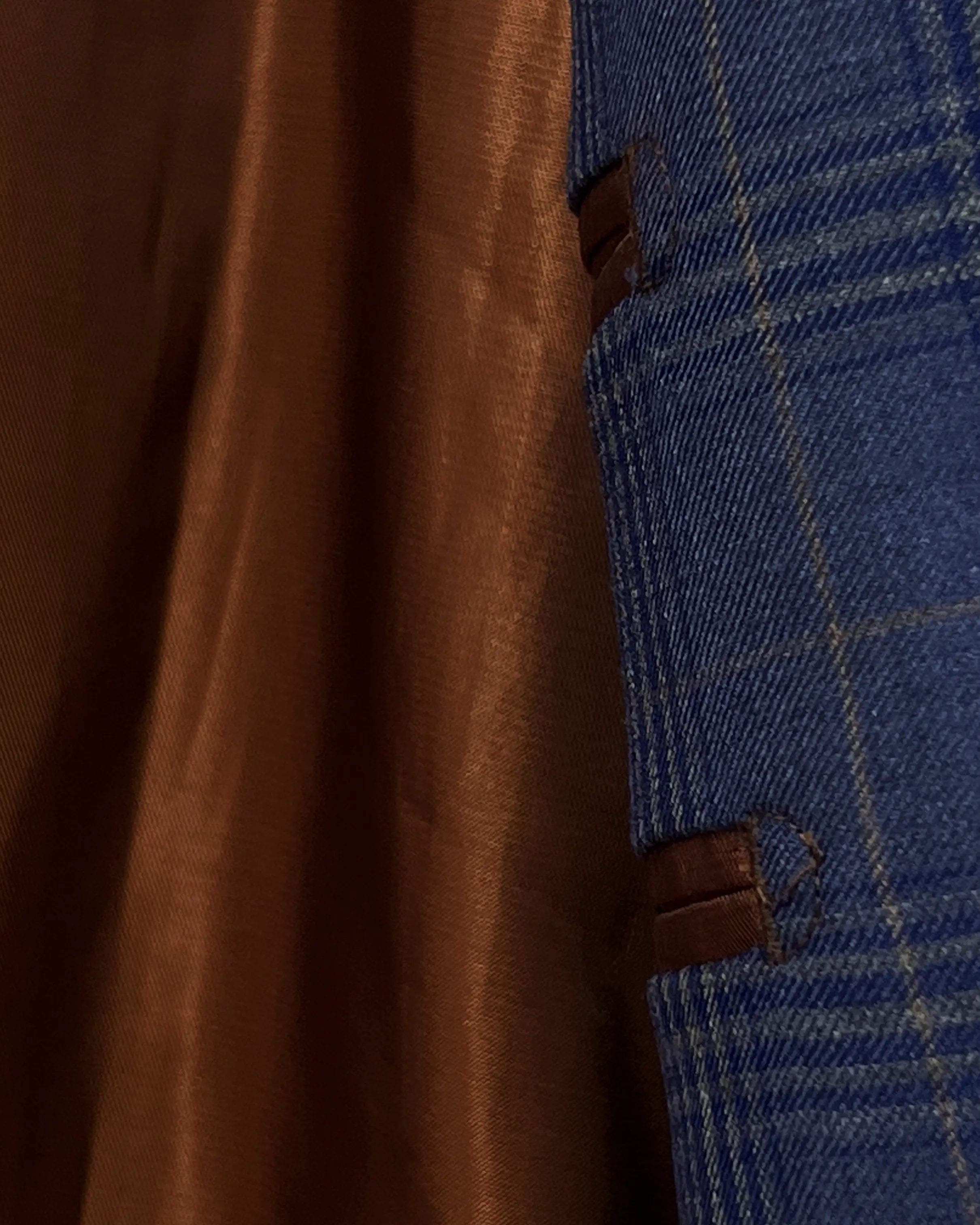 Lining detail of blue windowpane plaid men's suit showing bronze Bemberg silk lining