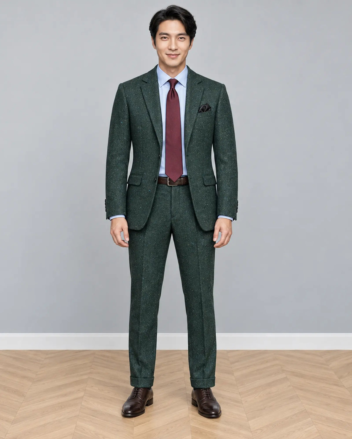 Full body front view of dark forest green Donegal tweed men's suit showing the complete tailored silhouette