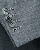 Sleeve cuff close up of grey sharkskin men's suit showing functional sleeve buttons