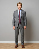 Front model view of grey sharkskin men's suit showing full outfit styling