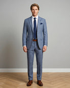 Front model view of light blue Prince of Wales glen plaid with navy windowpane men's suit showing full body styling