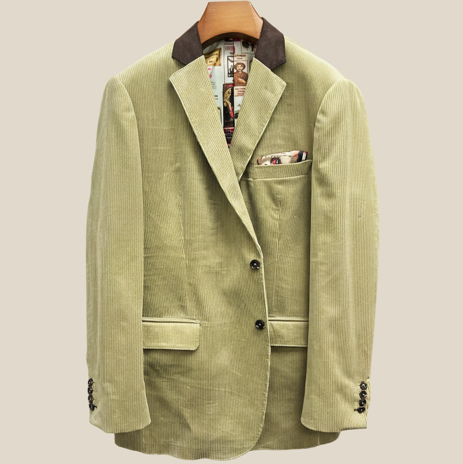 Front button panel of tan corduroy sport coat featuring chocolate brown horn buttons and hand pick stitching