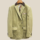 Front button panel of tan corduroy sport coat featuring chocolate brown horn buttons and hand pick stitching