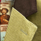 Close-up view of tan corduroy sport coat showing dark brown suede collar detail with hand-finished stitching