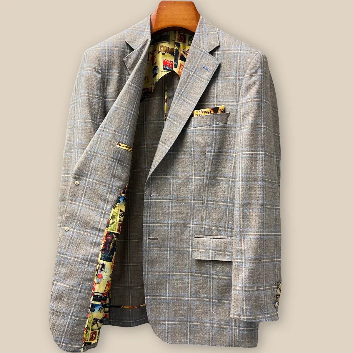 Interior right side of tan blue windowpane sport coat revealing mosaic lining and internal half-lined construction details