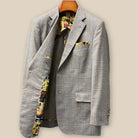 Interior right side of tan blue windowpane sport coat revealing mosaic lining and internal half-lined construction details