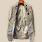 Full interior view of custom sport coat showcasing luxurious champagne gold paisley lining with Westwood Hart branding