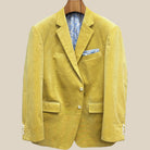 Front button panel of warm mustard yellow corduroy sport coat featuring light cream horn buttons with caramel swirl and hand pick stitching
