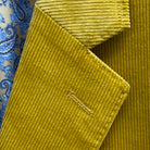 Classic notch lapel detail on warm mustard yellow corduroy sport coat showing hand pick stitching and distinctive 10 wale texture