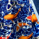 Full spread of interior lining showing complete koi and goldfish swimming pattern