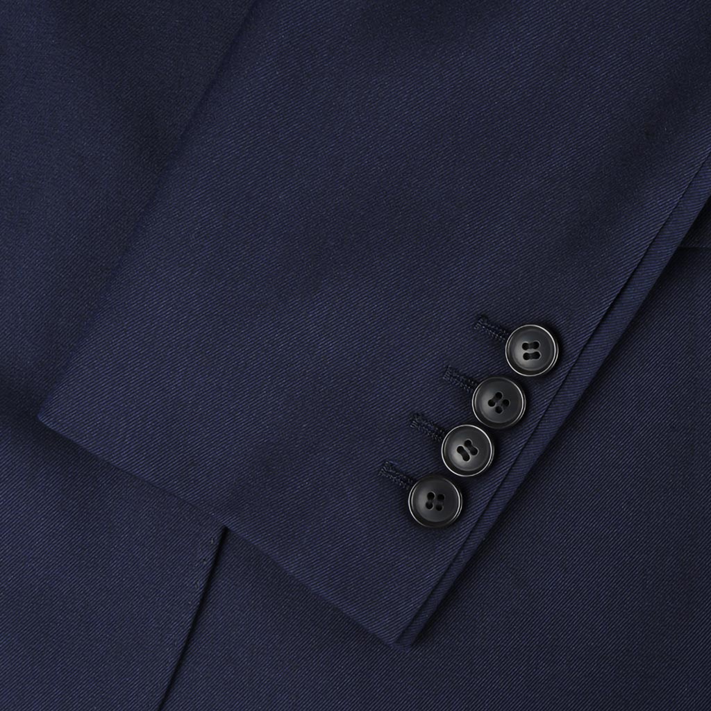 Plain weave navy custom suit, close-up of the sleeve cuffs and buttons for work attire