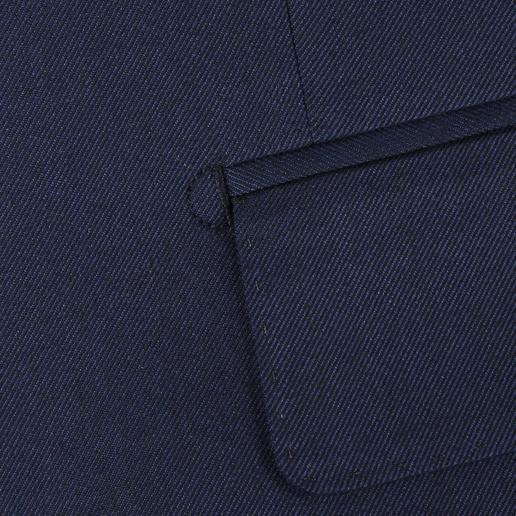 Close-up of the plain weave fabric on a navy custom suit for online design